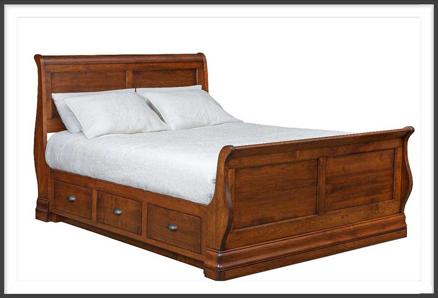 Curved head- and footboard sleigh bed with storage drawers. Heirloom hardwood bedroom furniture, made in USA.