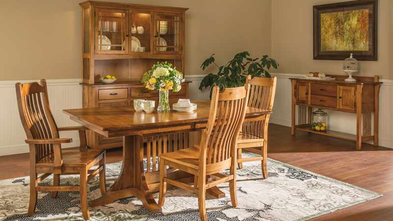 Traditional extension dining table with 4 chairs, sideboard, and china hutch.